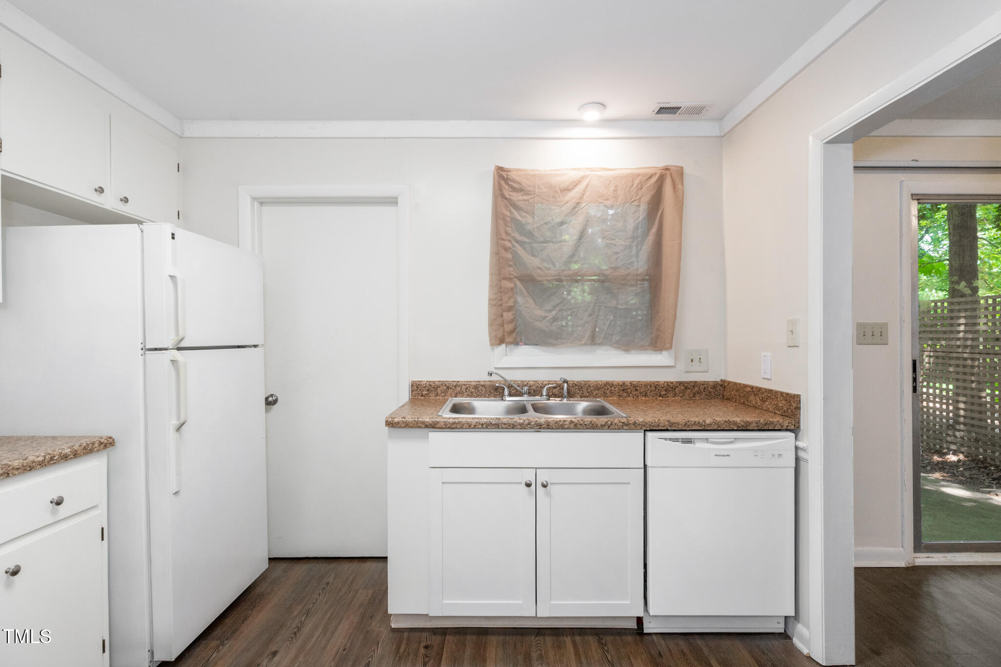 1809-1811 Quail Ridge Road Raleigh, NC 27609 - Photo 9 of 32 a utility room with cabinets washer and dryer
