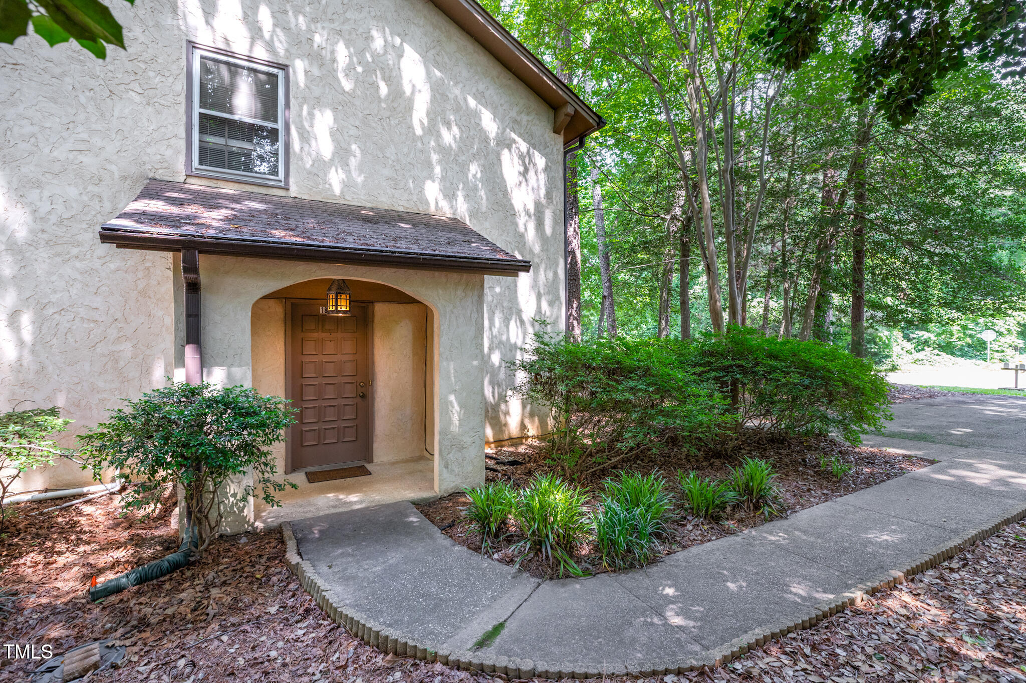 1809-1811 Quail Ridge Road Raleigh, NC 27609 - Photo 17 of 32 a front view of a house with garden