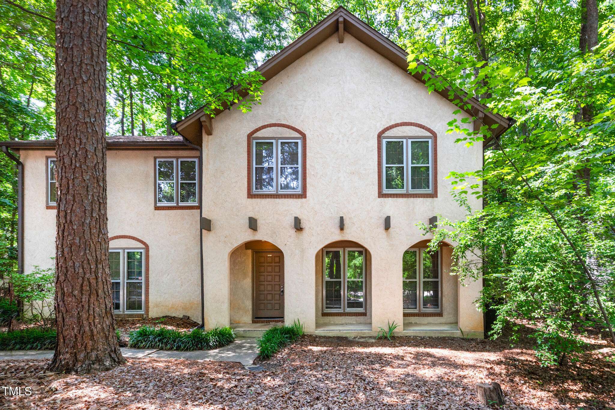 1809-1811 Quail Ridge Road Raleigh, NC 27609 - Photo 2 of 32 a view of multiple house with garden