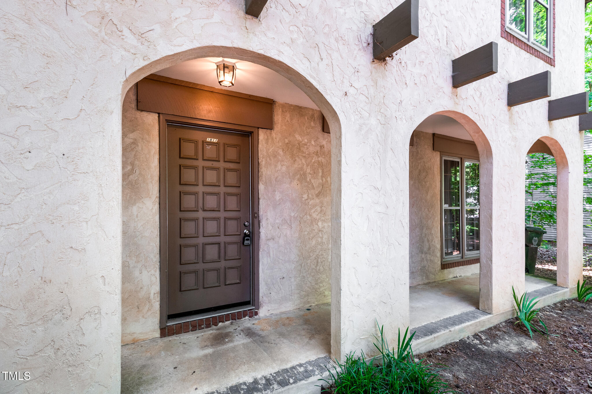1809-1811 Quail Ridge Road Raleigh, NC 27609 - Photo 4 of 32 a view of front door of a house