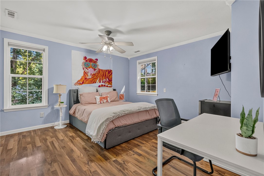 120 Logans Way Seneca, SC 29678 - Photo 10 of 28 Hardwood floors and generous windows create a light-filled and warm bedroom.