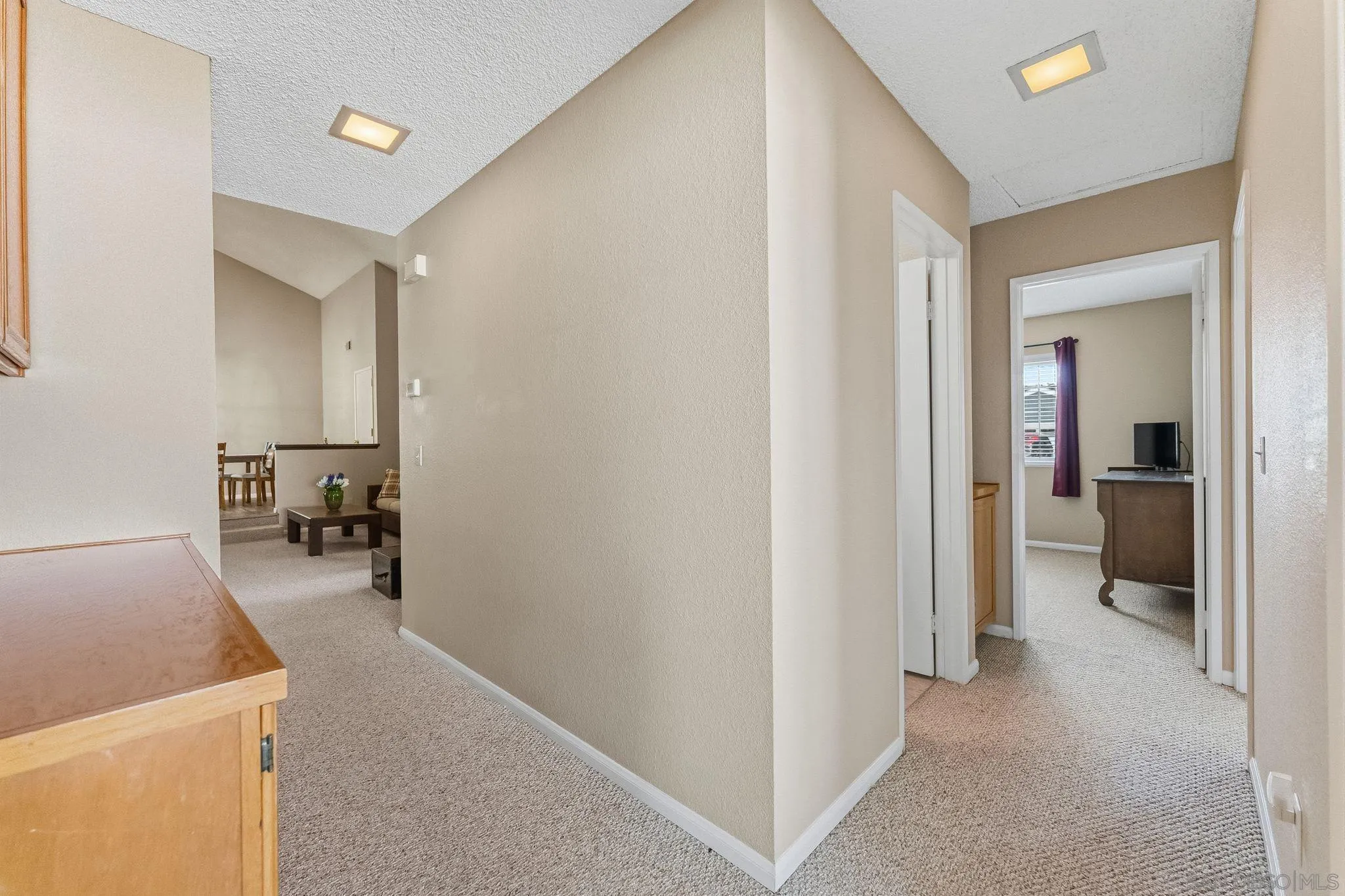 10565 Strathmore Drive Santee, CA 92071 - Photo 41 of 59 a view of a hallway to a livingroom and a livingroom with furniture