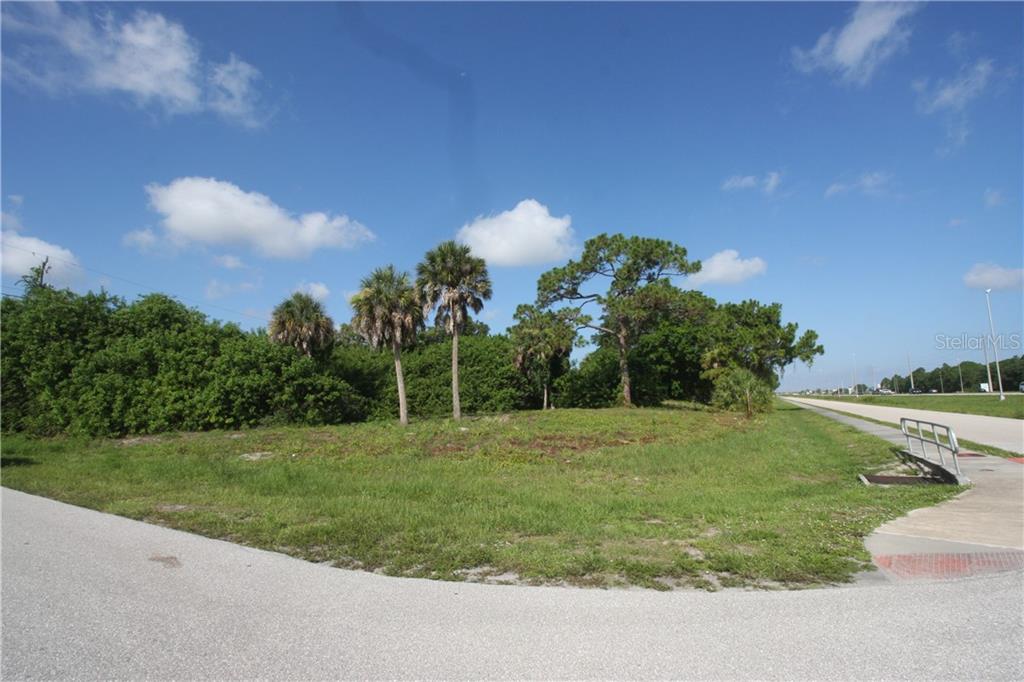 4547 South Access Road Englewood, FL 34224 - Photo 1 of 1 a view of a grassy field