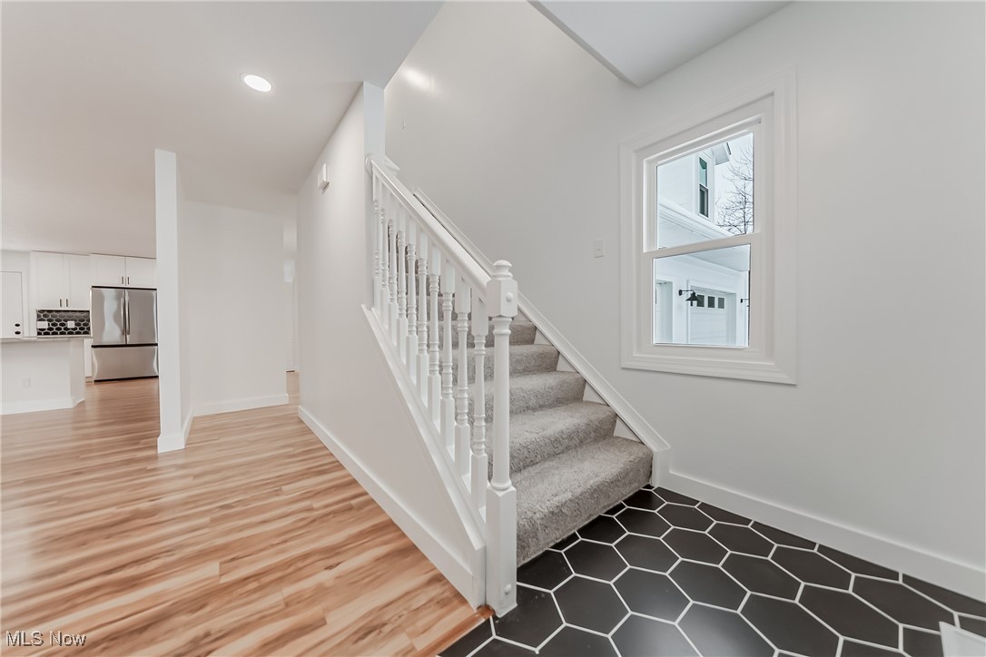 7488 Greenwich Road Seville, OH 44273 - Photo 10 of 37 Stairway with baseboards and recessed lighting