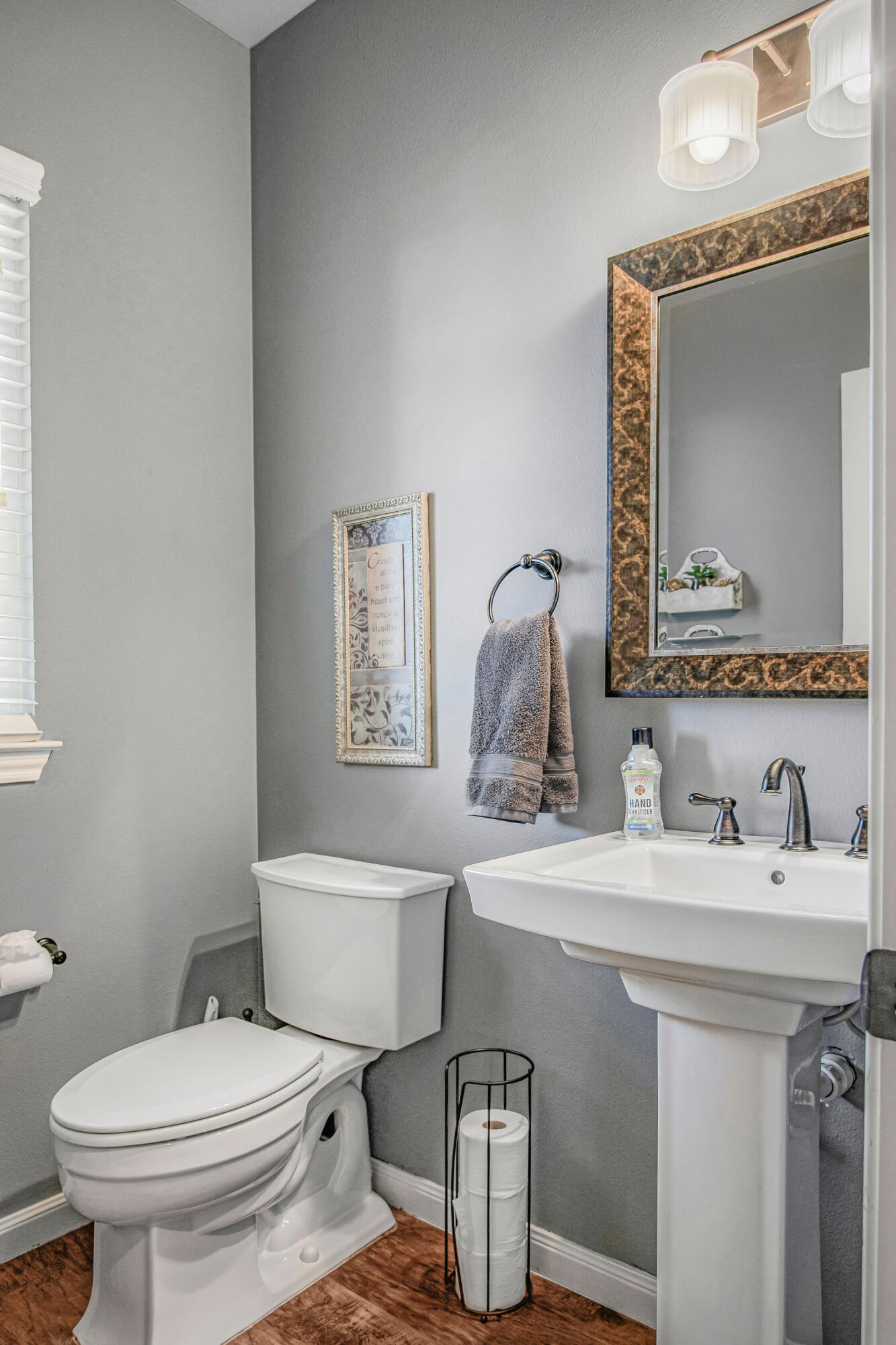 10117 Chicago Avenue Lubbock, TX 79424 - Photo 20 of 36 a bathroom with a toilet sink and mirror