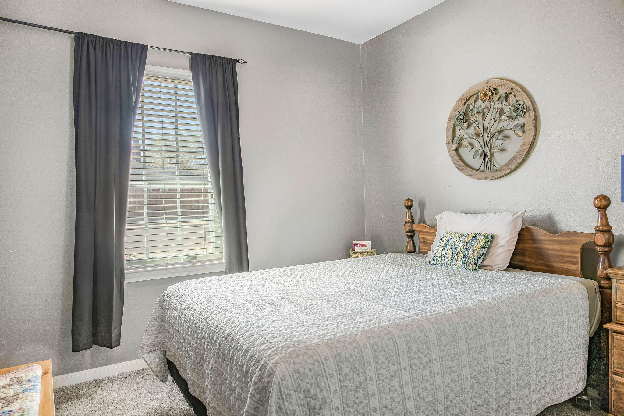 10117 Chicago Avenue Lubbock, TX 79424 - Photo 22 of 36 a bedroom with a bed and a large window