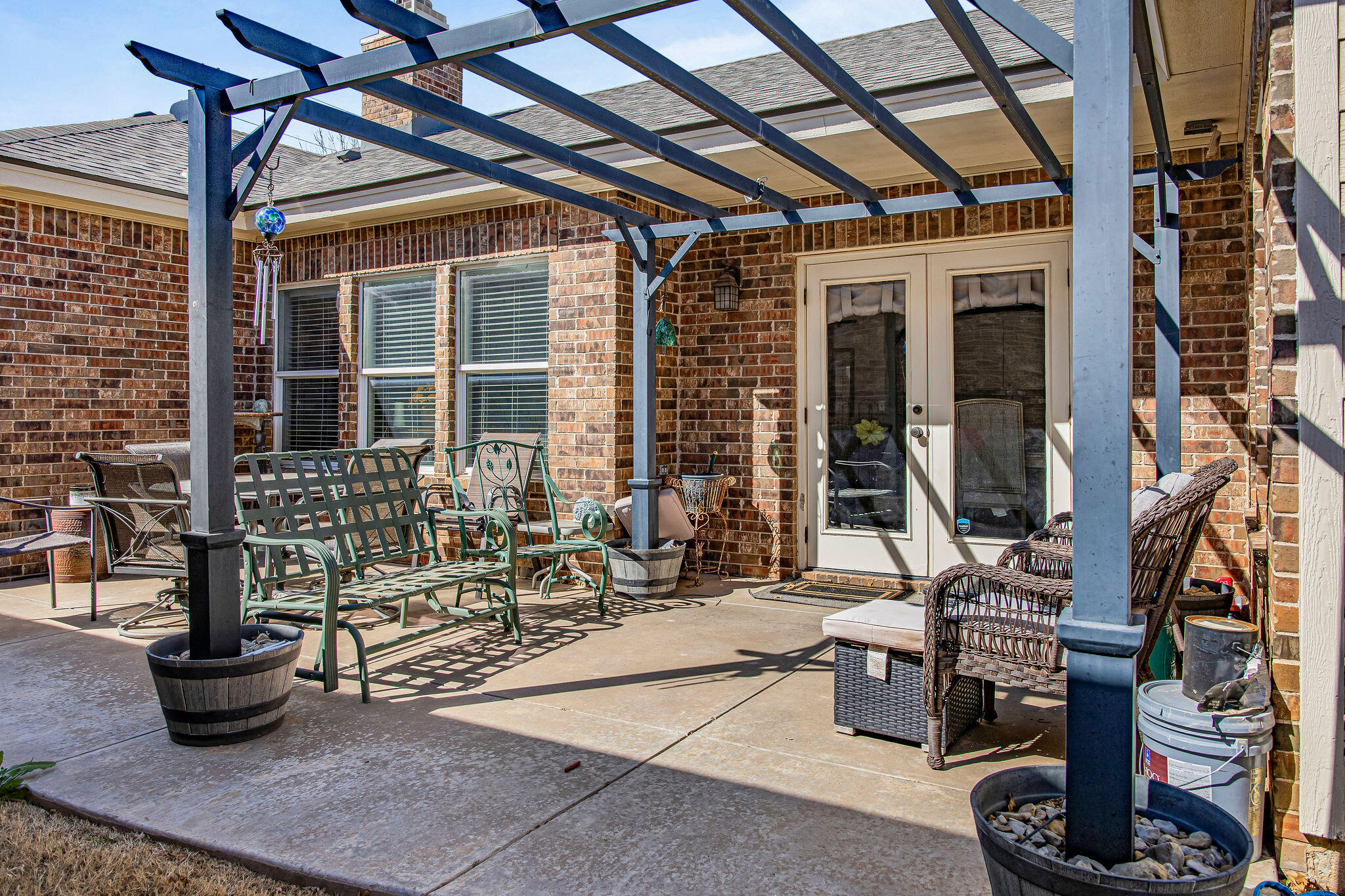 10117 Chicago Avenue Lubbock, TX 79424 - Photo 31 of 36 a building outdoor space with patio furniture and potted plants