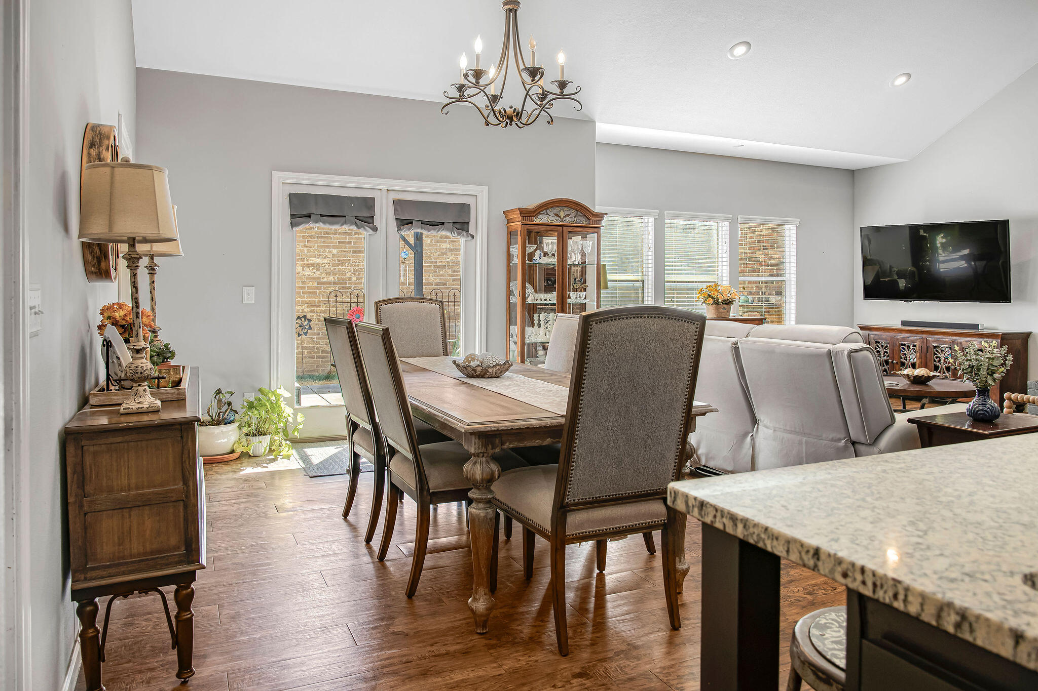 10117 Chicago Avenue Lubbock, TX 79424 - Photo 4 of 36 a view of a dining room with furniture window and wooden floor