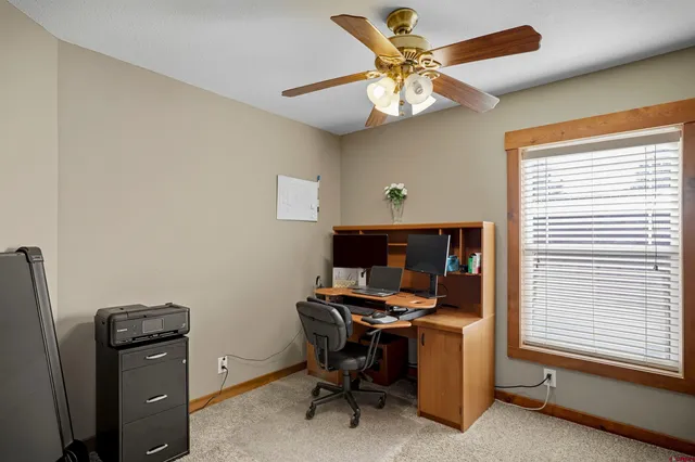 a view of a hallway with paintings on the wall