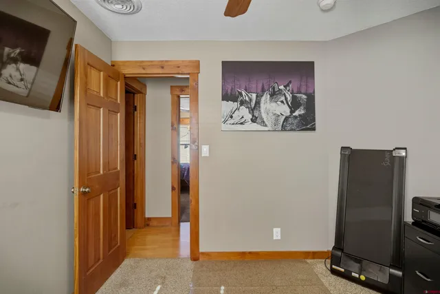 a bed room with a bed and a television