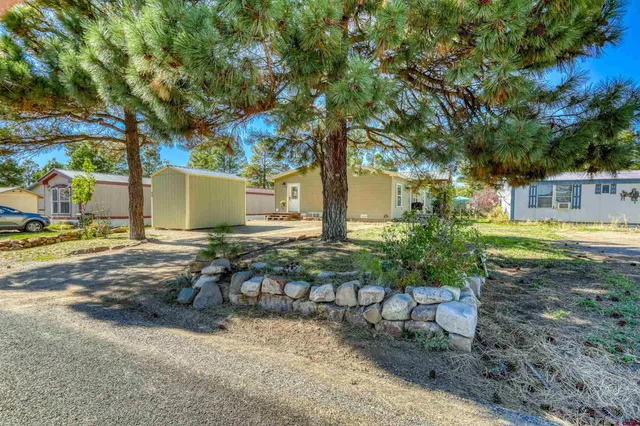 a view of a dinning table and chairs in patio