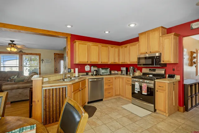 a dining room with furniture and window