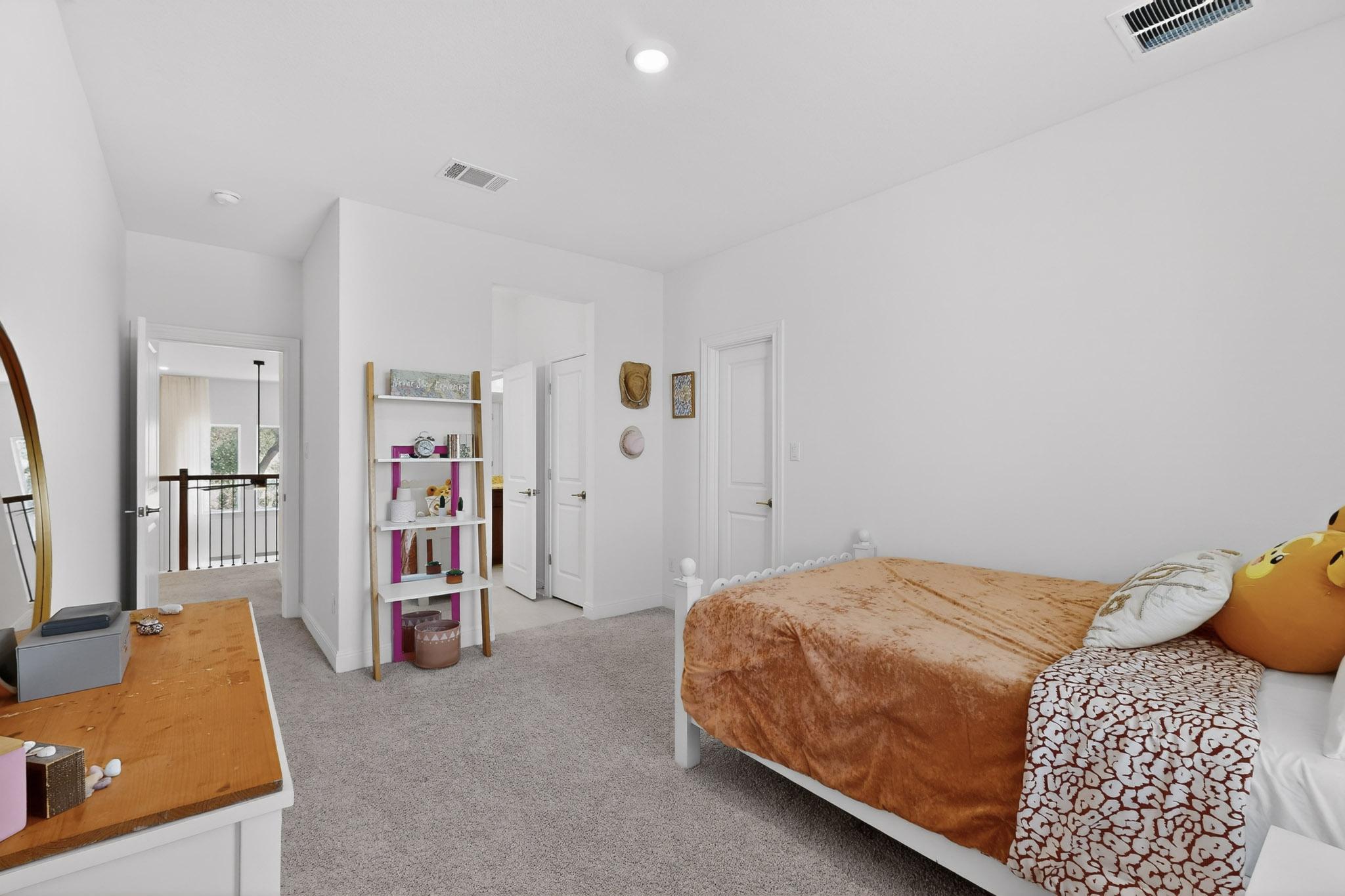 249 Running Bird Road Austin, TX 78737 - Photo 24 of 40 Bedroom with light carpet