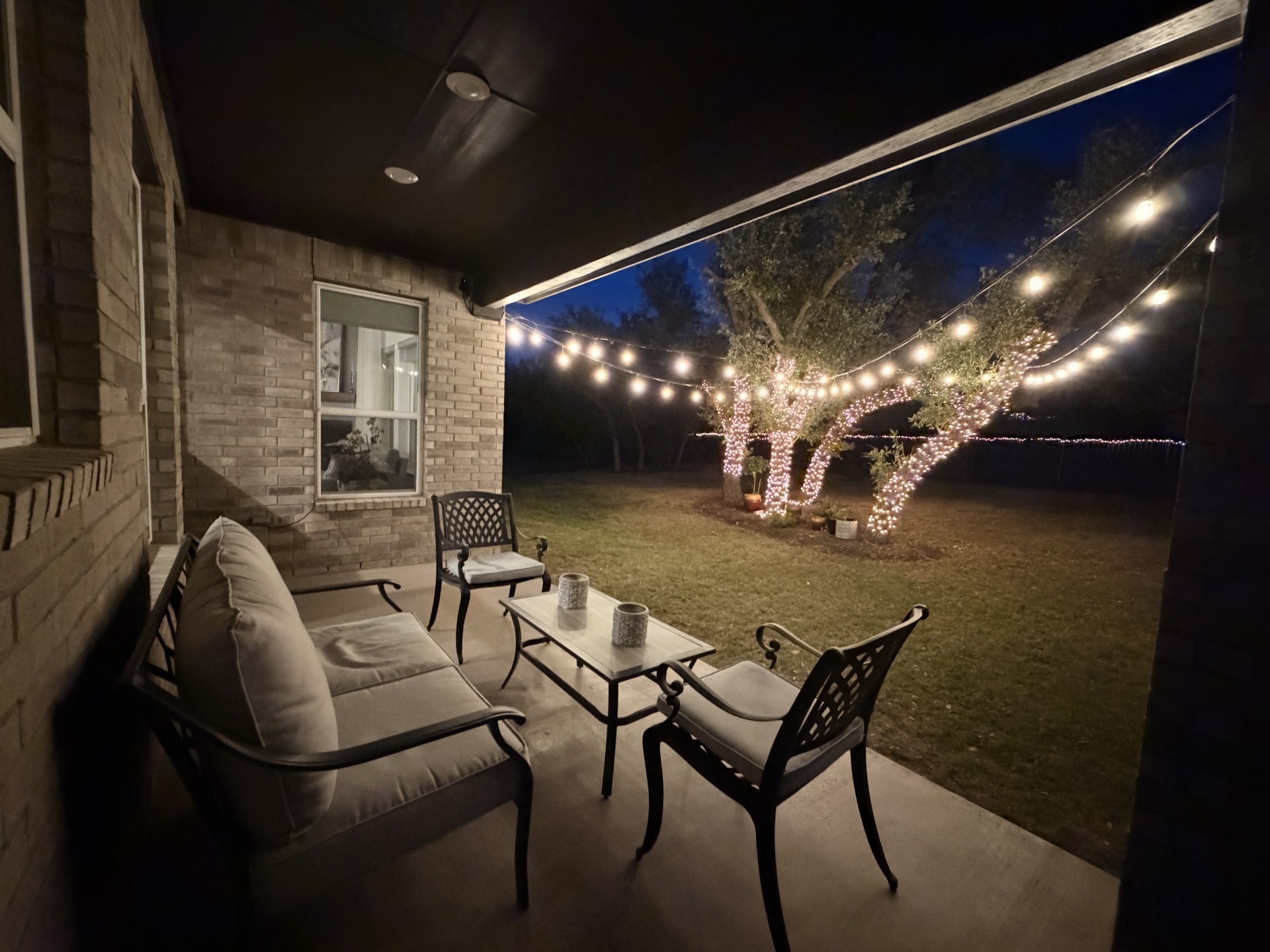 249 Running Bird Road Austin, TX 78737 - Photo 37 of 40 Patio at twilight with a patio, an outdoor living space, and a yard
