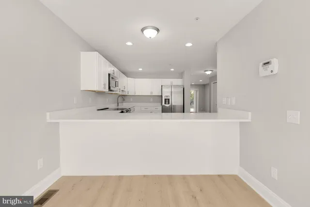 a view of kitchen with wooden floor