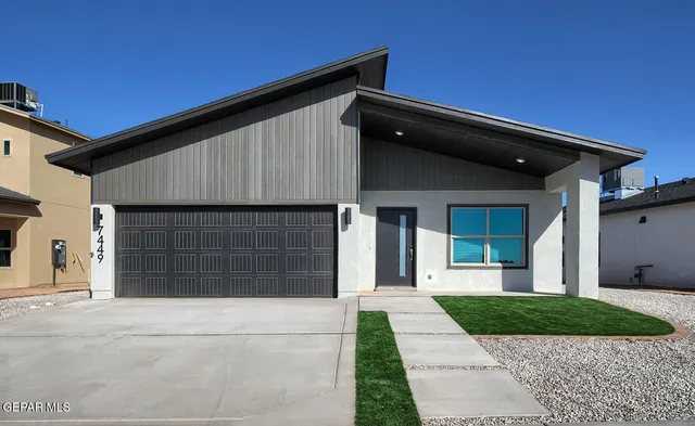 a front view of a house with a garage