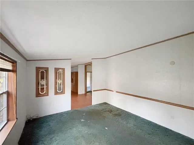 a view of empty room with windows