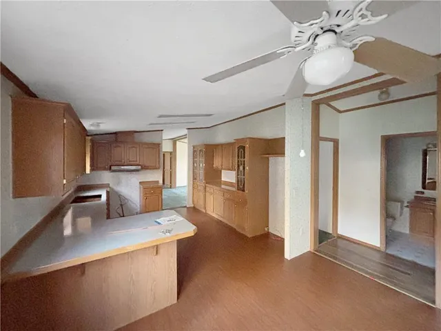 a kitchen with stainless steel appliances a sink stove and refrigerator