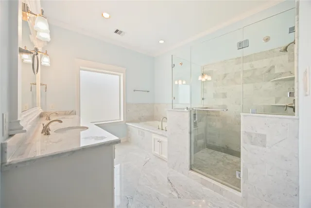 a spacious bathroom with a shower sink and mirror