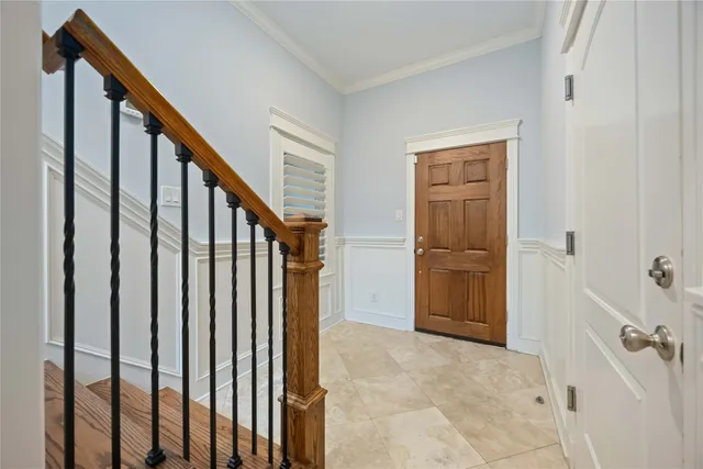 a view of an entryway with wooden floor