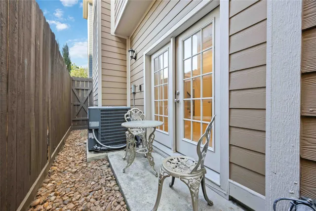 a view of a two chairs in the balcony