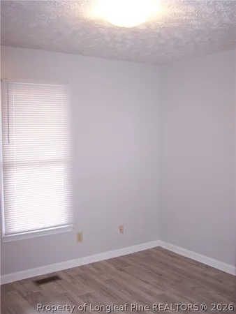 a bathroom with a shower and a toilet