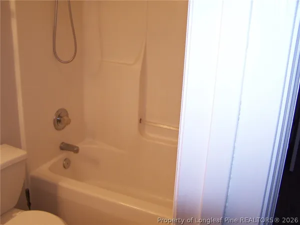 a bathroom with a bathtub and a sink