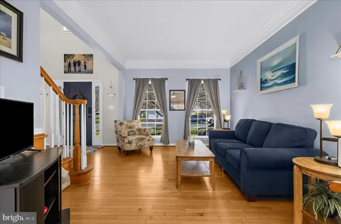a kitchen with stainless steel appliances granite countertop a stove a sink dishwasher and a flat screen tv