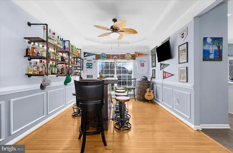 a kitchen with kitchen island a counter top space cabinets and stainless steel appliances