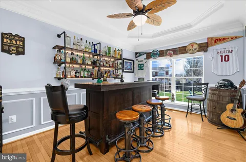 a kitchen with kitchen island a counter top space cabinets and stainless steel appliances