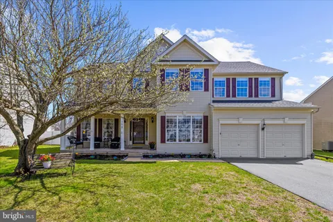 a view of backyard with sitting area