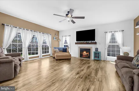 a view of a livingroom with furniture and a gym