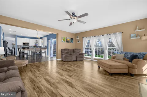 a view of a livingroom with workspace and a window