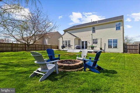 a view of backyard with a garden and entertaining space