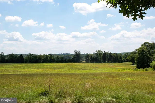 a view of a lake with a big yard