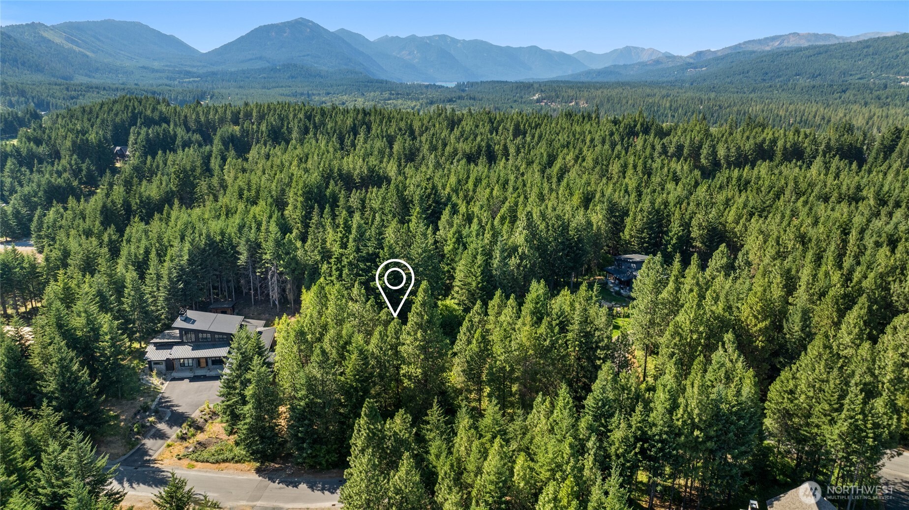 711 Ruby King Loop Cle Elum, WA 98922 - Photo 1 of 27 a view of a lush green field with a tree
