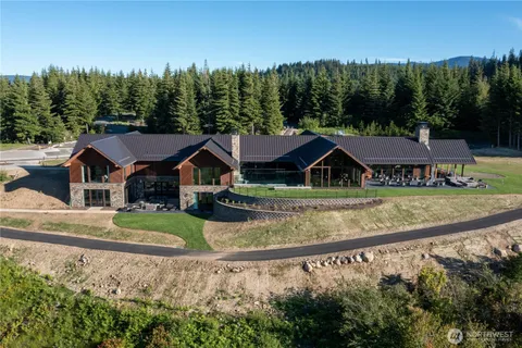 a view of house with a swimming pool