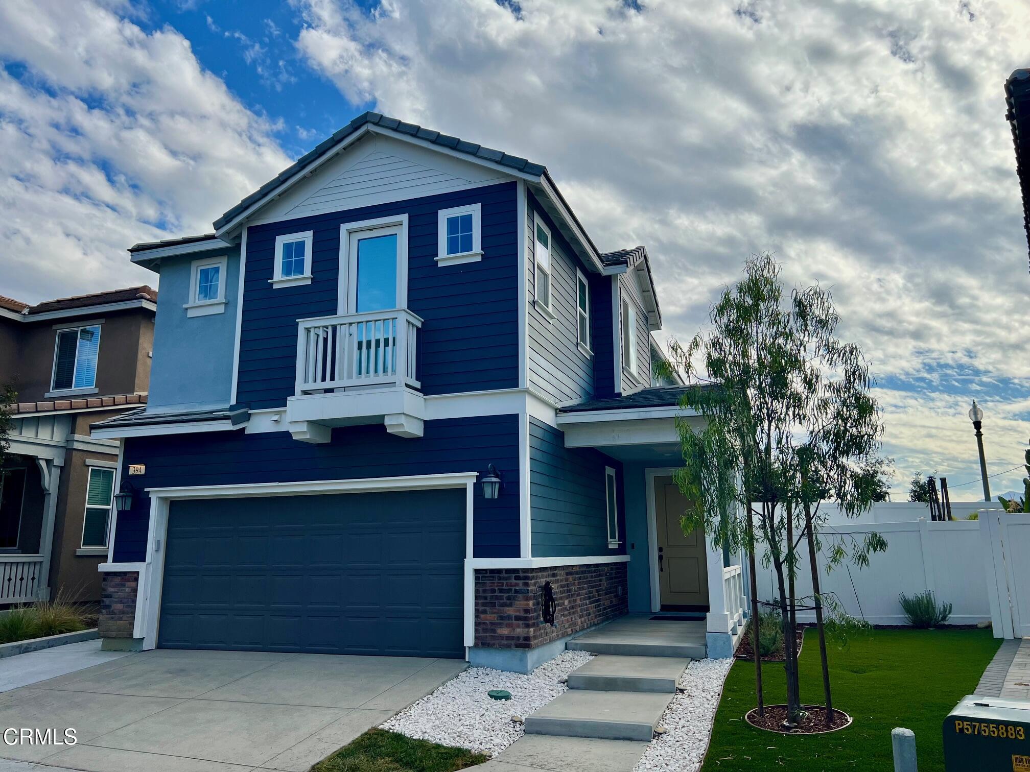 394 Water Lily Street Fillmore, CA 93015 - Photo 1 of 39 a front view of a house with a yard