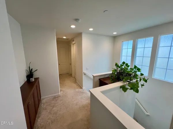 a living room with furniture and a chair
