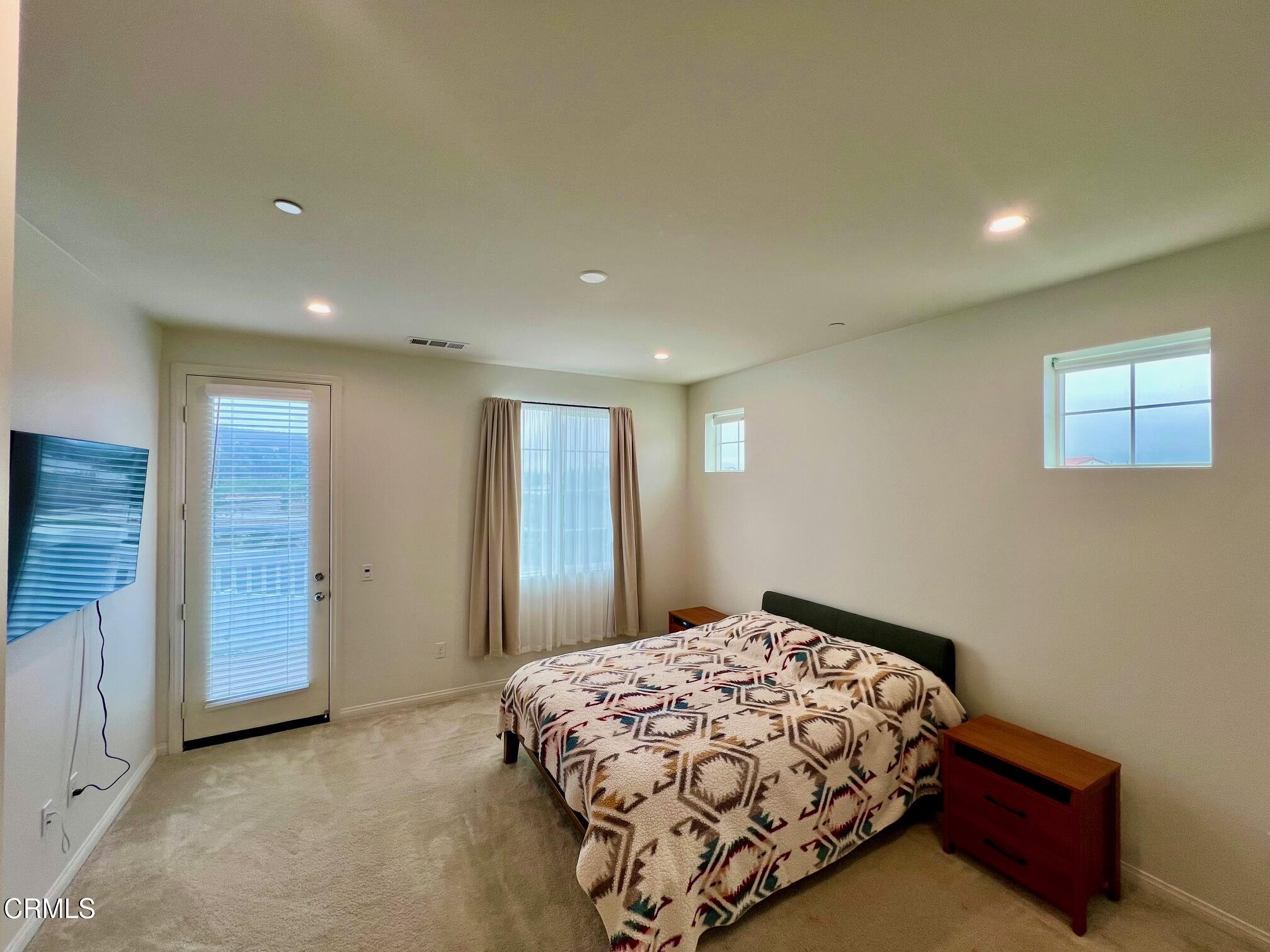 394 Water Lily Street Fillmore, CA 93015 - Photo 16 of 39 a bedroom with a bed and a dresser