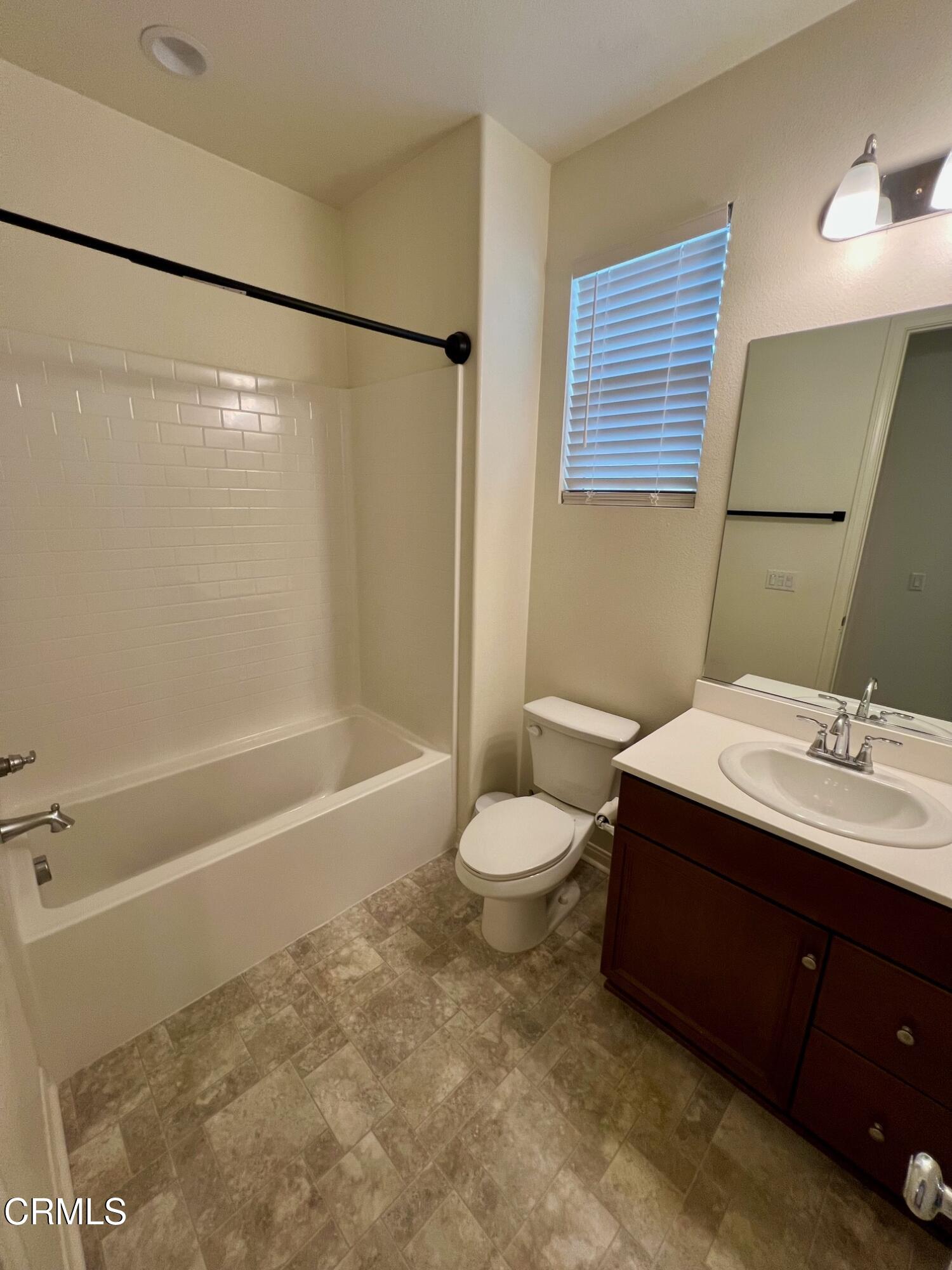 394 Water Lily Street Fillmore, CA 93015 - Photo 23 of 39 a bathroom with a sink and a mirror