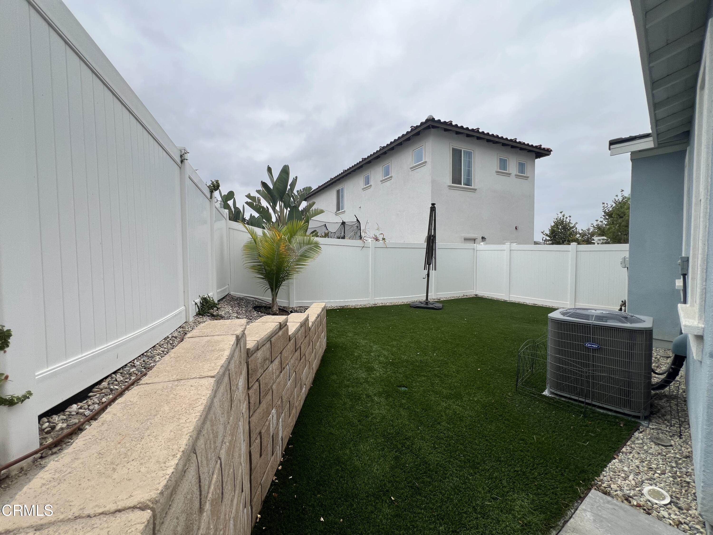 394 Water Lily Street Fillmore, CA 93015 - Photo 30 of 39 a house view with a garden space