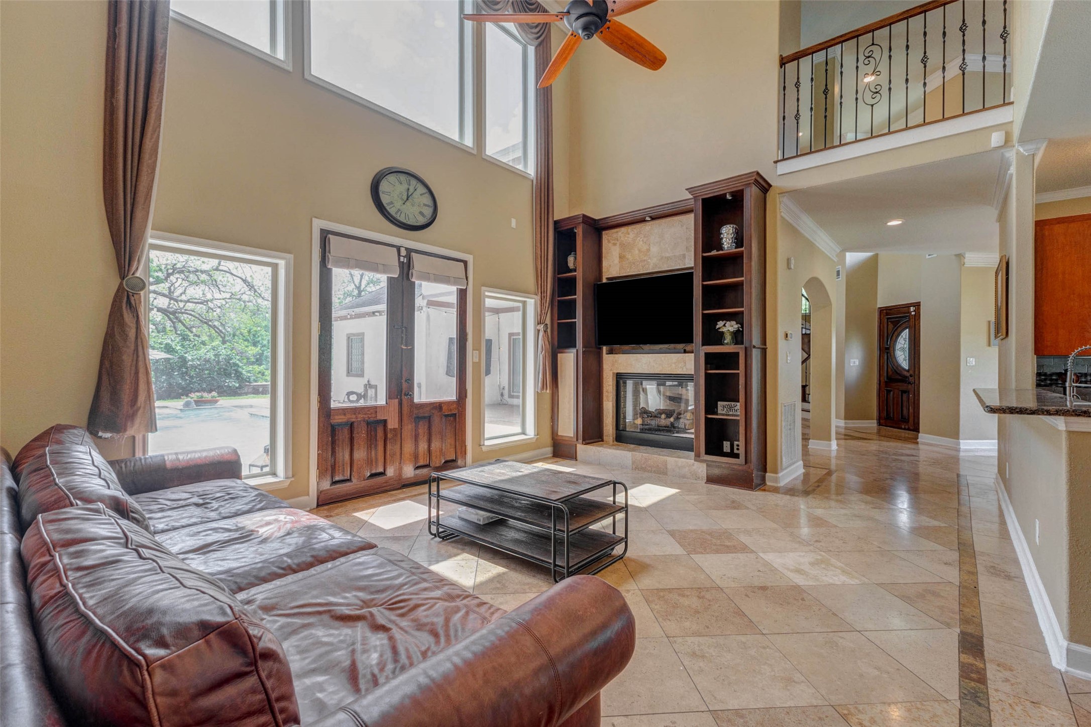 5610 Westerham Weston Lakes, TX 77441 - Photo 17 of 47 a living room with furniture a flat screen tv and a large window