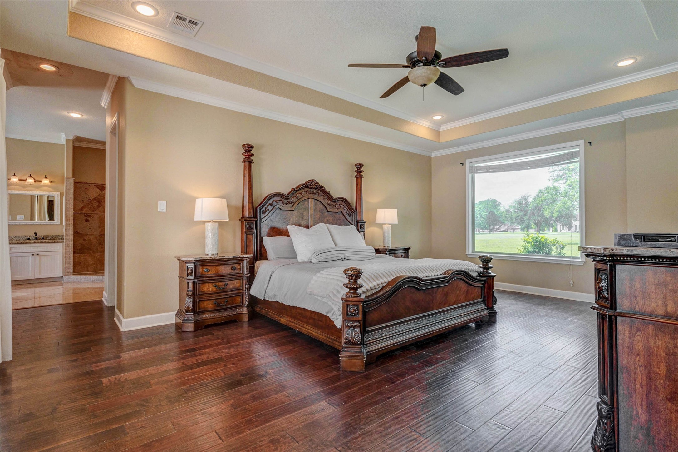 5610 Westerham Weston Lakes, TX 77441 - Photo 18 of 47 a bedroom with a bed and large windows