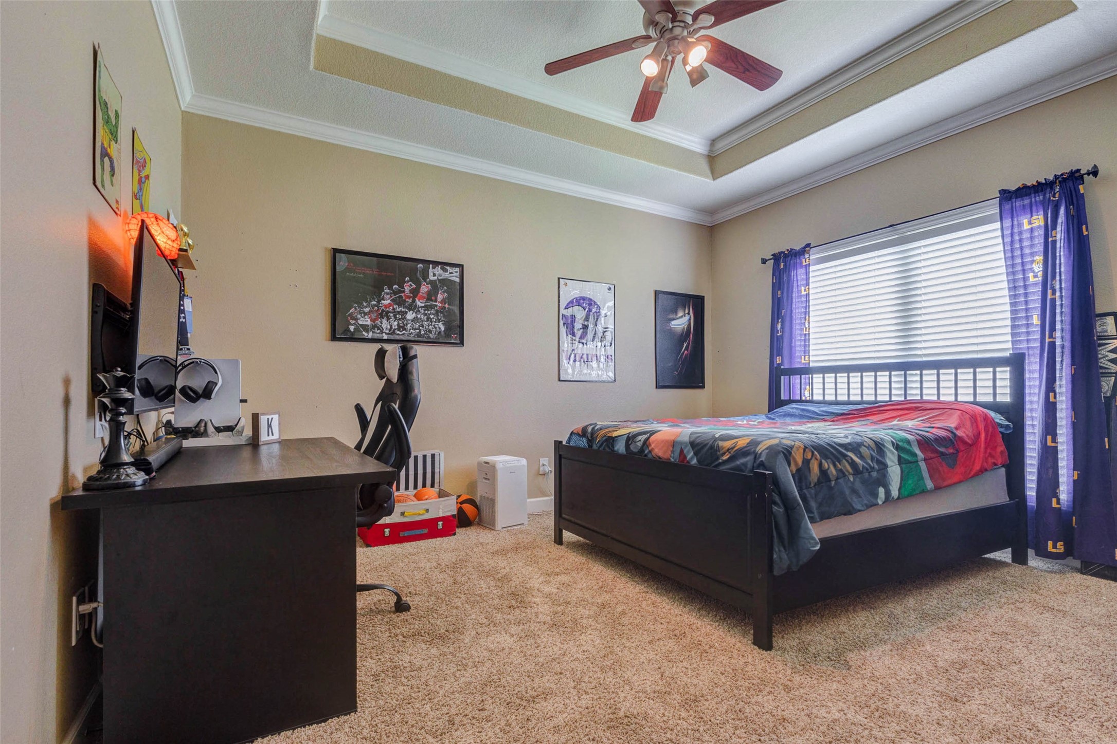 5610 Westerham Weston Lakes, TX 77441 - Photo 32 of 47 a bedroom with a bed and a chandelier