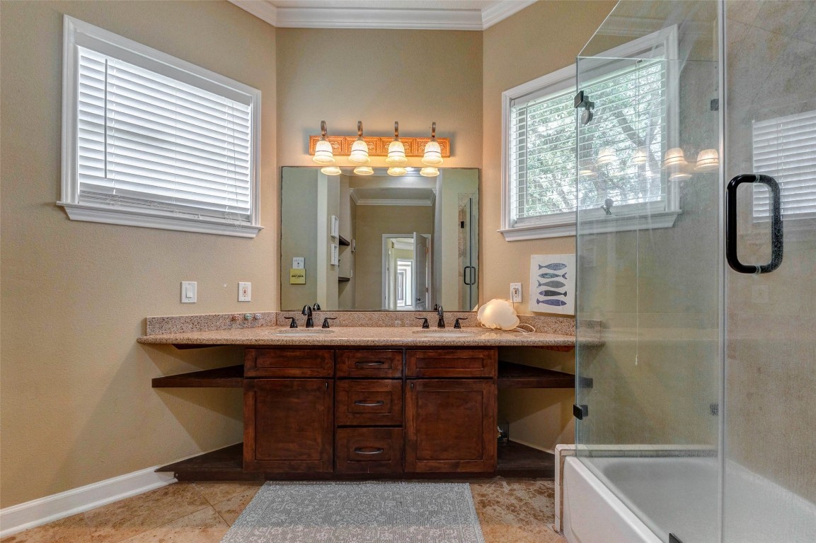 5610 Westerham Weston Lakes, TX 77441 - Photo 33 of 47 a bathroom with a sink and a mirror