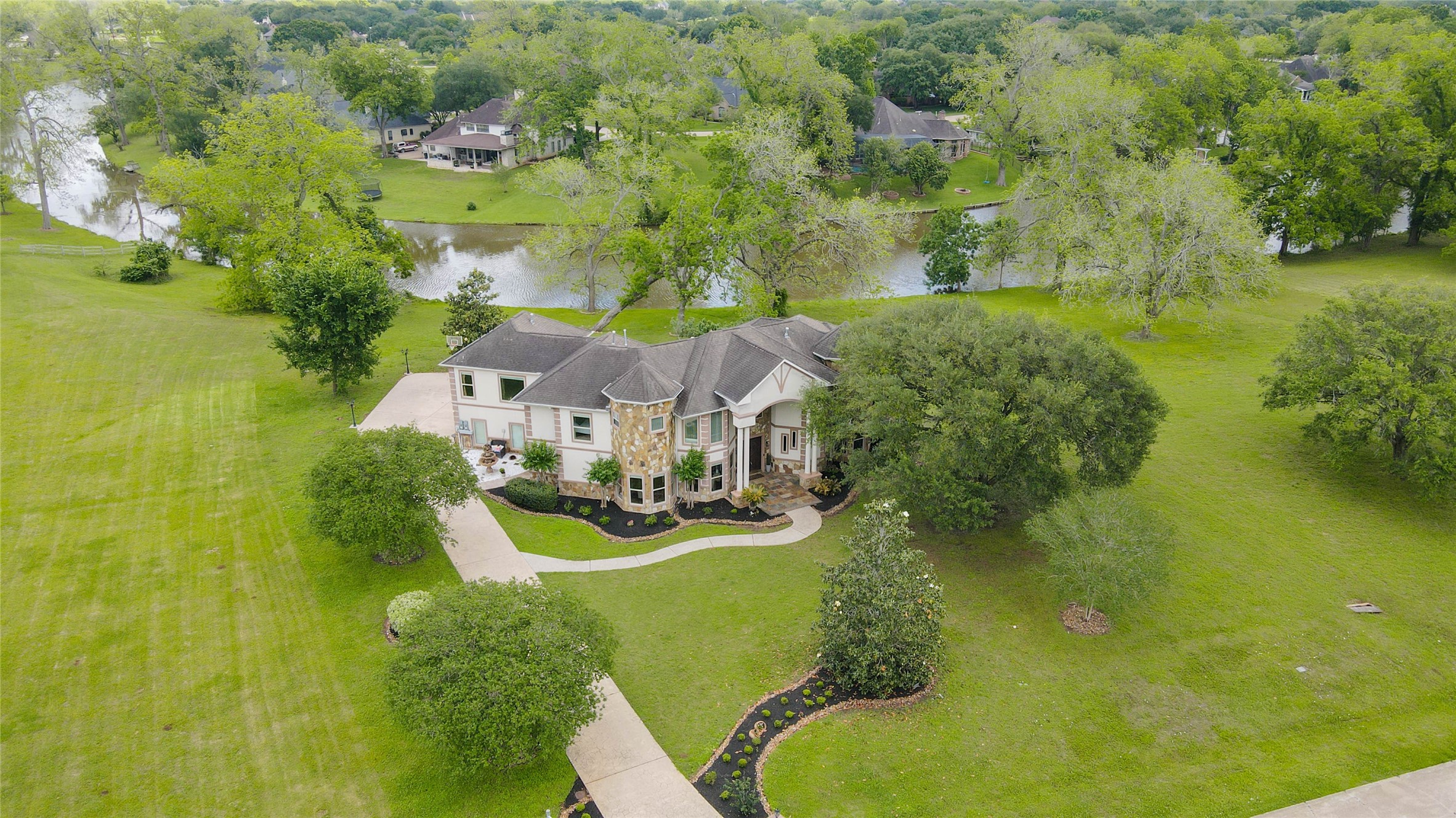 5610 Westerham Weston Lakes, TX 77441 - Photo 4 of 47 a view of a lake with houses