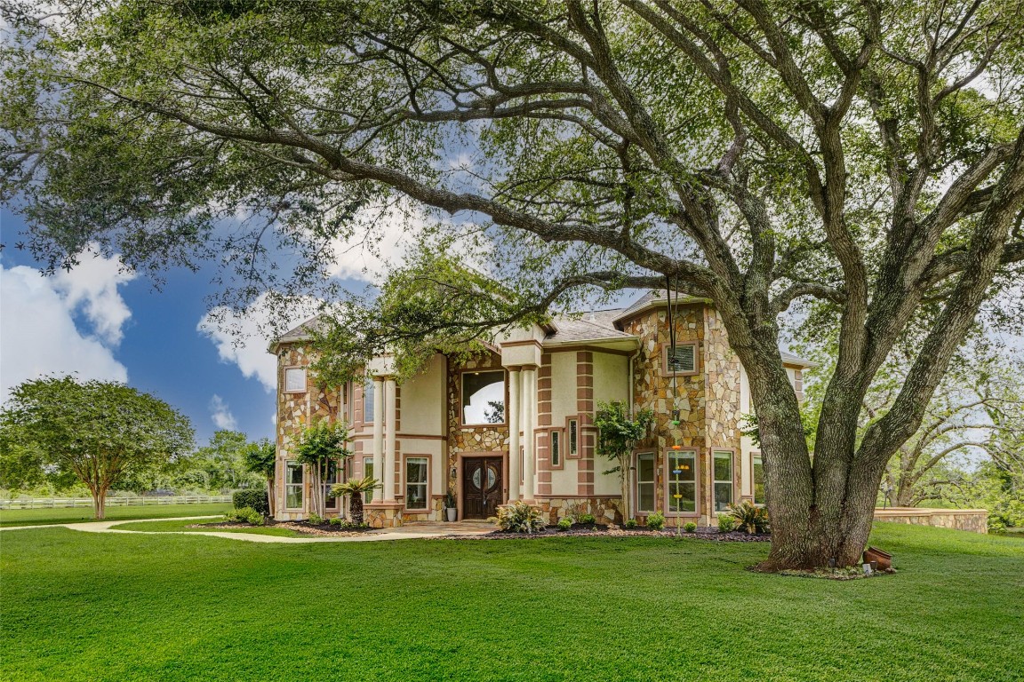 5610 Westerham Weston Lakes, TX 77441 - Photo 47 of 47 a front view of a building with a garden