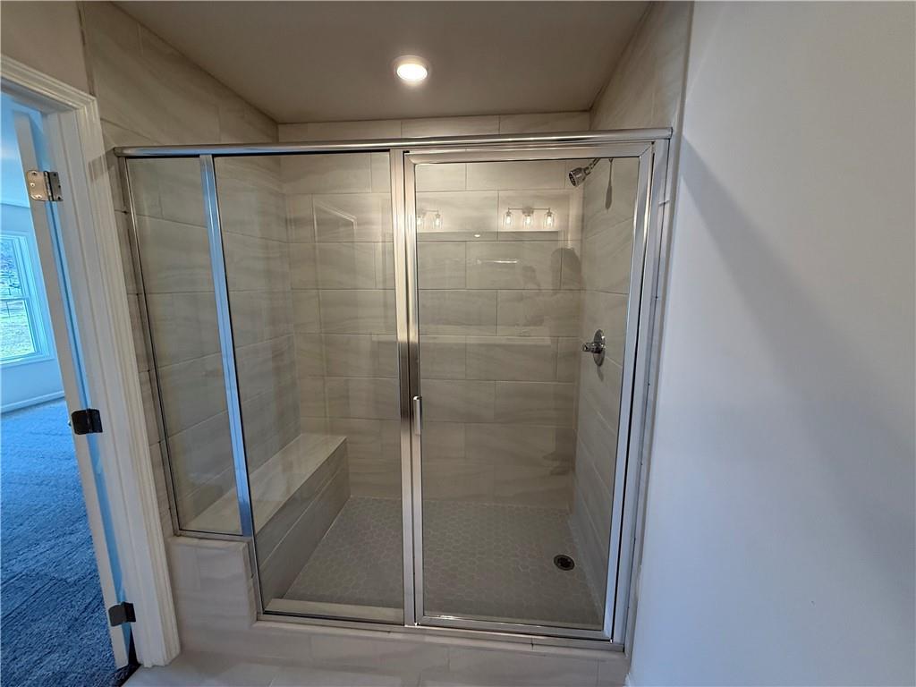 5143 Longview Run Decatur, GA 30035 - Photo 11 of 17 a bathroom with a glass door shower