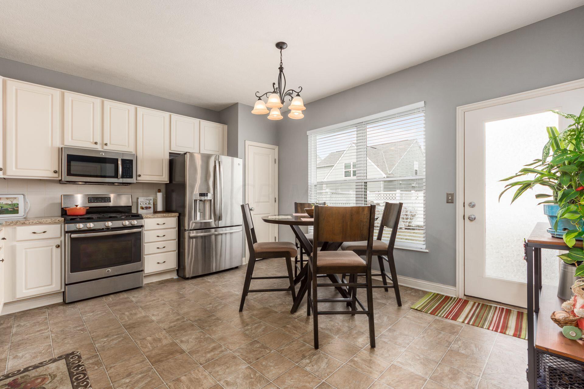 5892 McInnis Road Dublin, OH 43016 - Photo 9 of 33 Kitchen With SS Appliances